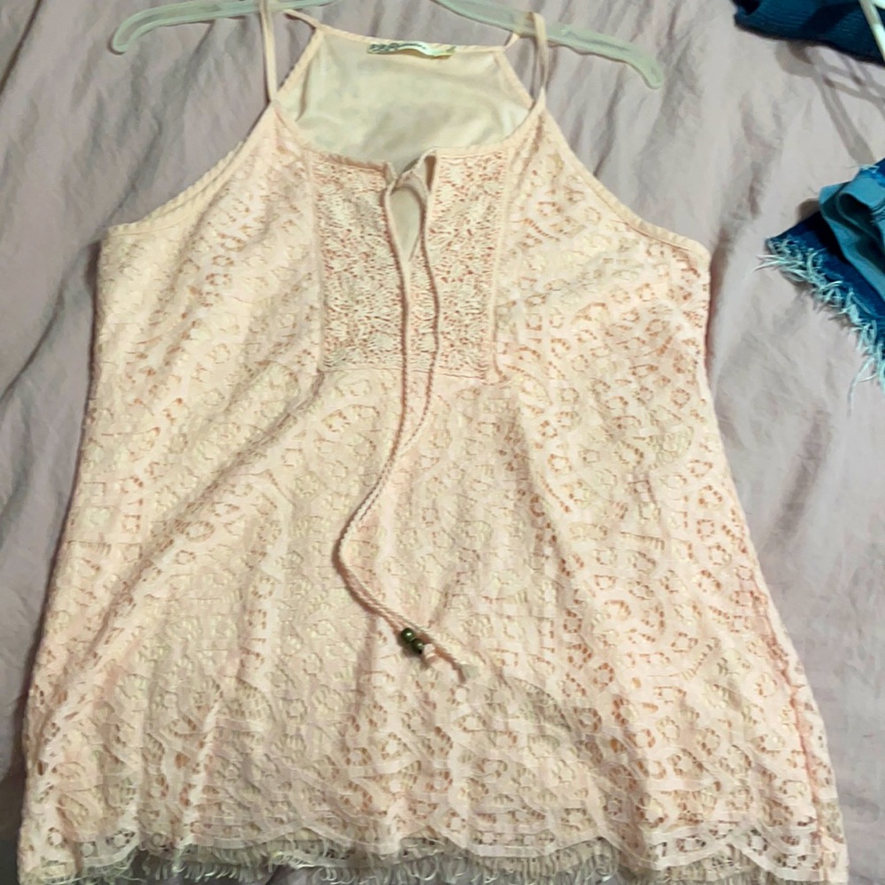 Lace detail tank top Missing beads on one string.